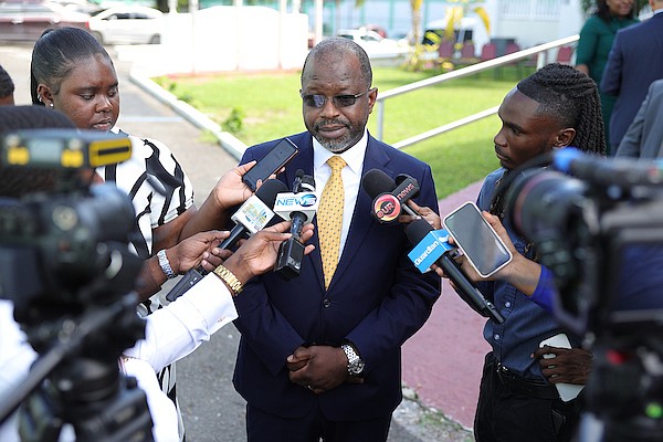 Minister of National Security Wayne Munroe KC speaks to reporters after the opening ceremony for The Bahamas Inter-Institutional Roundtable Meetings at Police Headquarters on September 23, 2024. Photo: Dante Carrer/Tribune Staff