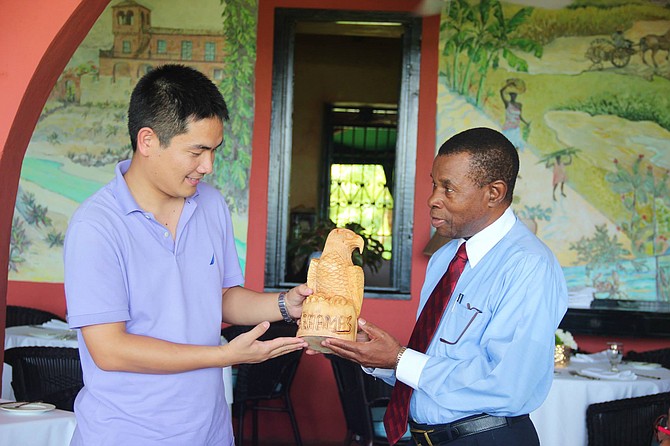 A wood-carved Bahamian Abaco Parrot was presented to Mr. Yang Guang as a farewell gift from then Bahamas China Friendship Association President Anthony Capron in 2015.