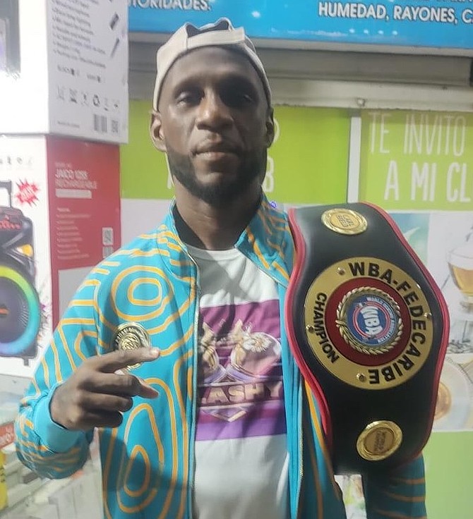 Carl Hield displays his championship belt.