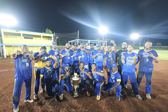 The Cyber Tech Blue Marlins celebrate after defeating the Chances Mighty Mitts 14-13 to win the New Providence Softball Association men’s championship title on Tuesday night. Photo: Chappell Whyms Jr