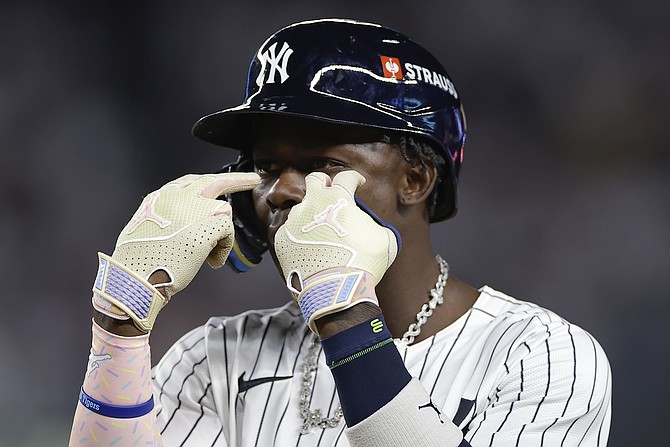 New York Yankees third base Jazz Chisholm Jr. reacts after a base hit against the Kansas City Royals during the seventh inning of Game 1 of the American League baseball division series, Saturday, Oct. 5, 2024, in New York. (AP Photo/Adam Hunger)