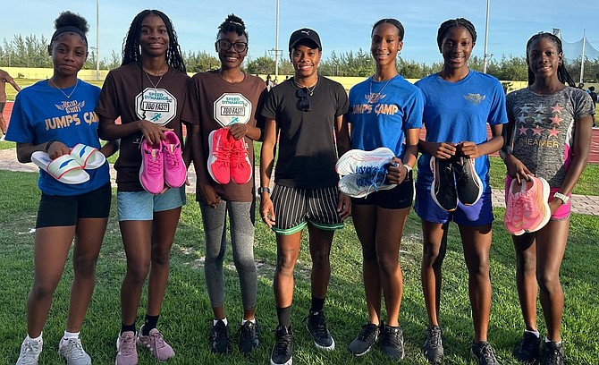 Devynne Charlton posing with the athletes she made shoe presentations to.