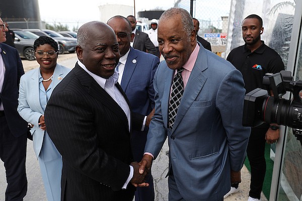 Prime Minister Philip "Brave" Davis shakes hands with FOCOL Chairman Sir Franklyn Wilson during the Commissioning Ceremony of two Dual-Fuel GE Turbine Generators at Sun Oil Headquarters on October 15, 2024. Photo: Dante Carrer/Tribune Staff