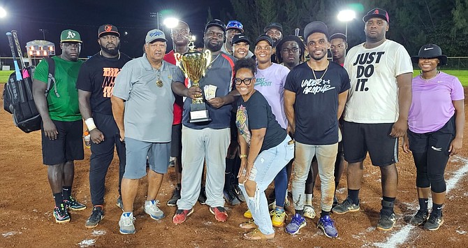 The Outsiders celebrate with their championship title.