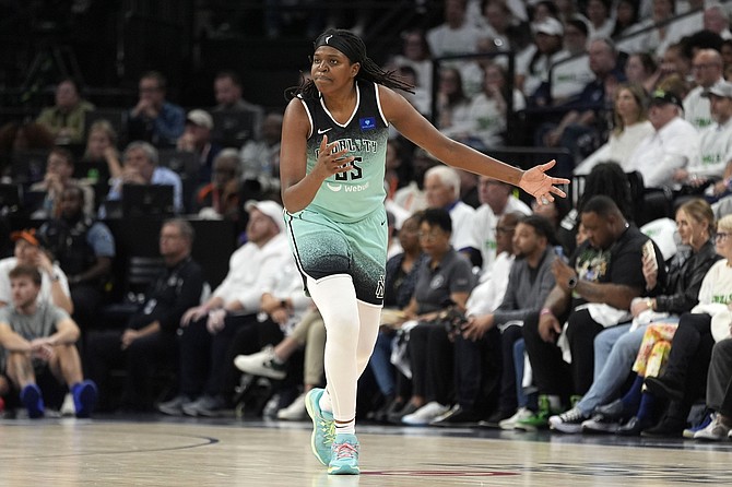 New York Liberty forward Jonquel Jones reacts after missing a shot during the second half against the Minnesota Lynx in Game 3 of a WNBA basketball final playoff series, Wednesday, Oct. 16, 2024, in Minneapolis. (AP Photo/Abbie Parr)