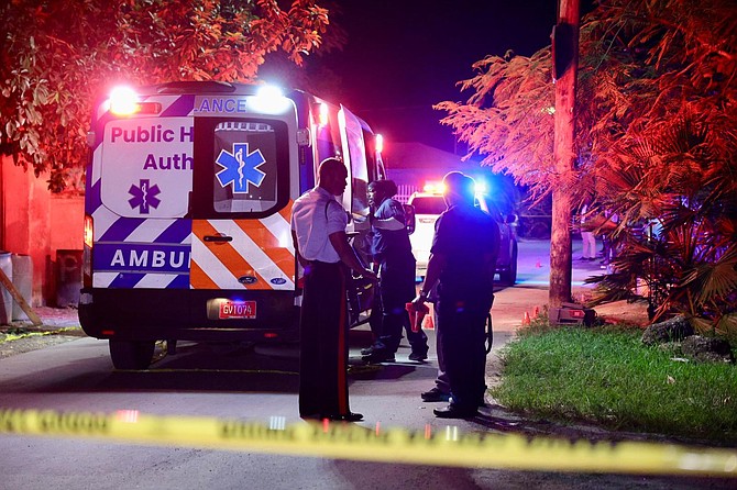 The scene in Martin Close off Cowpen Road on Saturday night after a double shooting that left one man dead and another being treated in hospital. 

Photo: Dante Carrer/Tribune Staff