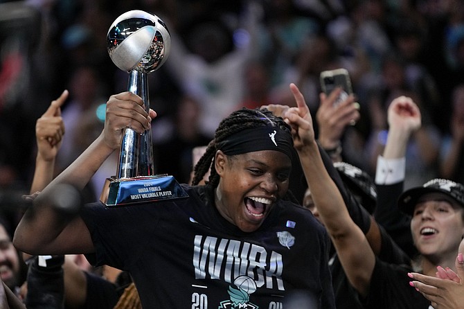 New York Liberty forward Jonquel Jones (35) reacts after being given the MVP Award last night after winning the championship against the Minnesota Lynx in Game 5 of the WNBA basketball final series, Sunday, October 20, 2024, in New York. (AP Photo/Pamela Smith)