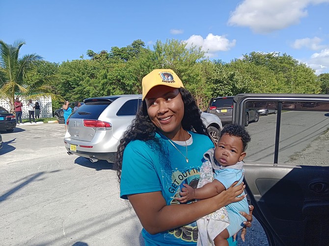 Phillipa Carey with her infant, on her arrival at the facility after flying in from Chub Cay on Thursday.