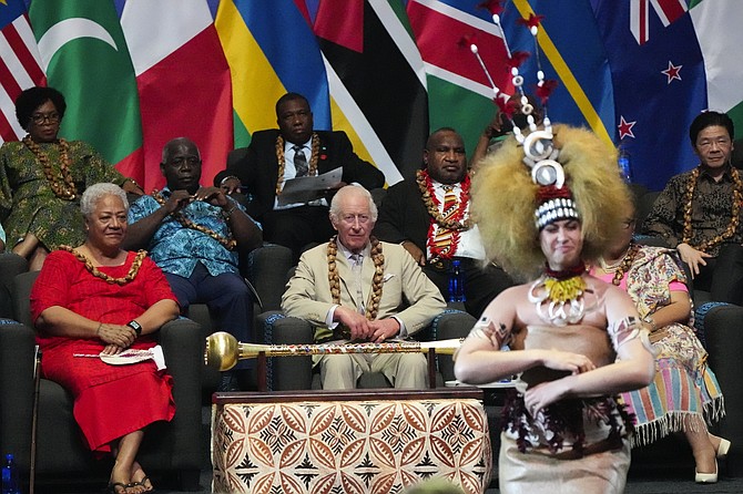 Britain’s King Charles and Samoan Prime Minister Afioga Fiamê Naomi Mata’afa, left, watch dancers perform during the opening ceremony for the Commonwealth Heads of Government meeting in Apia, Samoa, on Friday. Photo: Rick Rycroft/AP