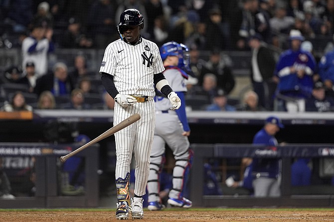 New York Yankees’ Jasrado “Jazz” Chisholm Jr throws his bat after striking out to end the eighth inning in Game 3 of the baseball World Series against the Los Angeles Dodgers on Monday, October 28, 2024, in New York. 
                                                                                                                                               (AP Photo/Godofredo A. Vásquez)