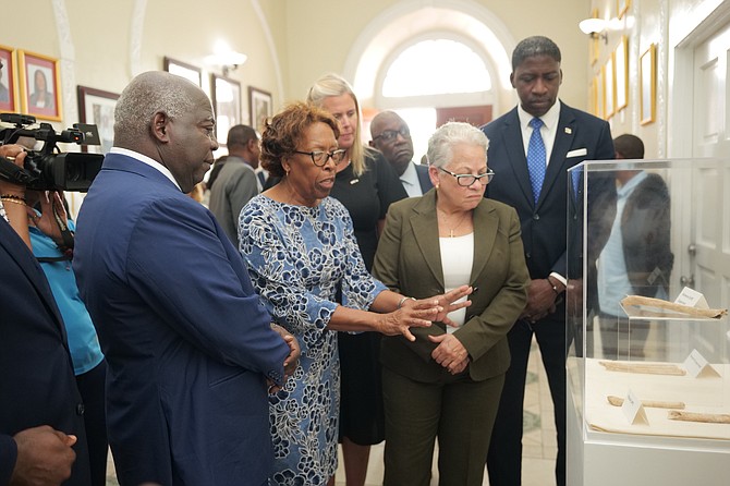 Prime Minister Philip Davis inspects the Arawak remains. 
Photo: Nikia Charlton