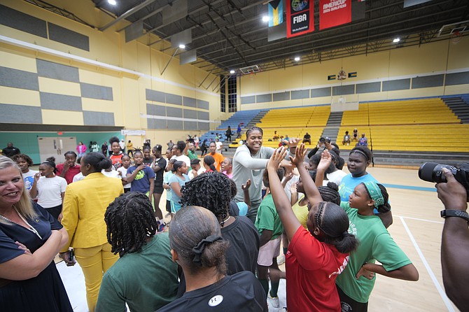 Jonquel Jones and coaches at the basketball clinic at the Kendal G L Issac Gym yesterday. Photos: Chappell Whyms Jr