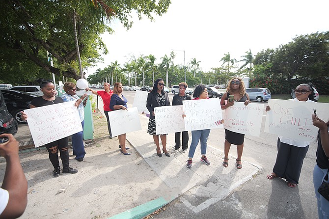 A Protest held outside CID yesterday led by Senators Maxine Seymour and Michela Barnett Ellis in the wake of the homicide of Adriel Moxey called for faster response times and better cooperation between the RBPF and community to keep children safe. Photo: Chappell Whyms Jr