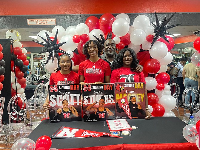 Coach Corrington Maycock with top junior throwers Dior-Rae Scott, Taysha Stubbs and Annae Mackey.