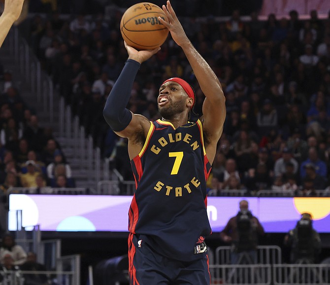 Golden State Warriors guard Buddy Hield (7) shoots during the second half of an NBA basketball game against the Brooklyn Nets in San Francisco, Monday, Nov. 25, 2024. (AP Photo/Jed Jacobsohn)