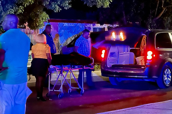 The body of a male in his mid-twenties being removed from the corner of West End Street and Market Street on December 1, 2024. The weekend saw four people shot in two separate incidents. Three died from their wounds. Photo: Dante Carrer/Tribune Staff