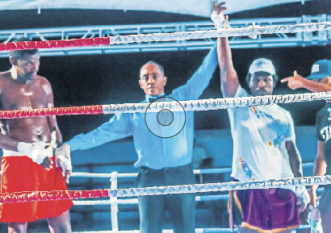 AND THE WINNER IS: Bahamian boxer D’Angelo Swaby has his hands raised in victory after his fight in Jamaica.