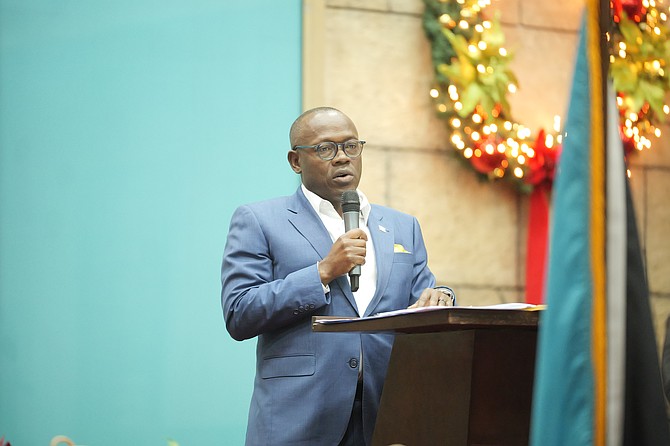 Minister of Tourism and Aviation Chester Cooper speaks at the Airport Authority training cohort graduation at Living Waters Kingdom Ministries in December 2024. Photo: Chappell Whyms Jr