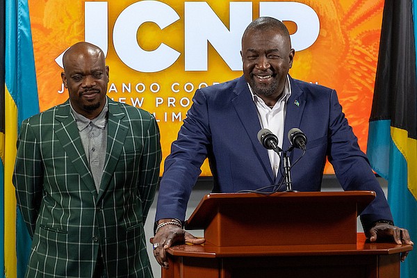 Minister of Youth, Sports and Culture Mario Bowleg, flanked by JCNP Chairman Dion Miller, speaks during the Office of the Prime Minister's Weekly Press Briefing on December 12, 2024. Photo: Dante Carrer/Tribune Staff