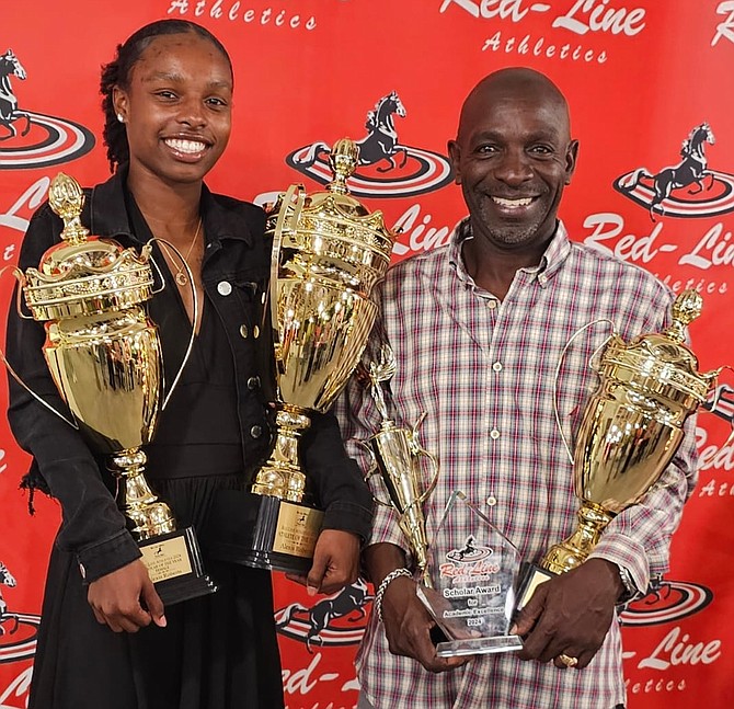 Alexis Roberts and coach Tito Moss proudly displaying the awards Roberts won.