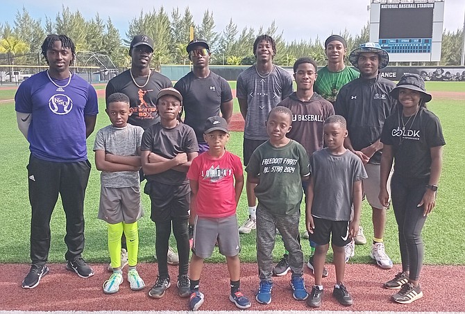 Antoan Richardson, far right, a former Major League Baseball player from 2011-2014, opened a five-day camp with local organisations Batter’s Box and LDK yesterday at the Andre Rodgers Baseball Stadium.