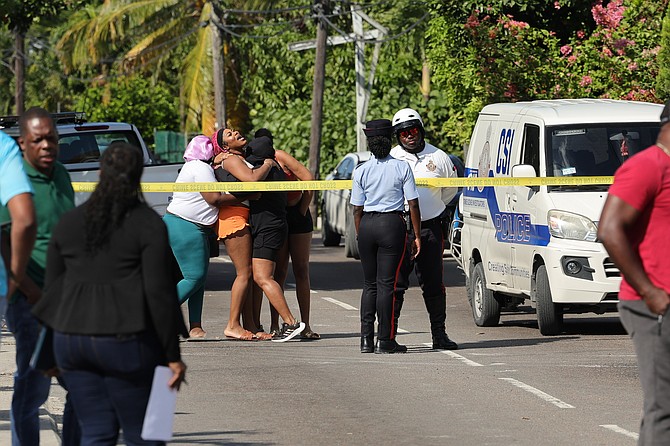 The scene in Bernard Road on Saturday morning after three people were killed in a shooting. 

Photo: Dante Carrer/Tribune Staff