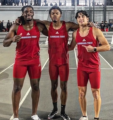 Oscar Smith Jr flanked by two of his Lousiana Tech team-mates.