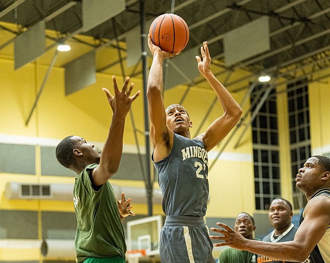 UB Mingoes forward Audley Russell battles in the paint for a basket.