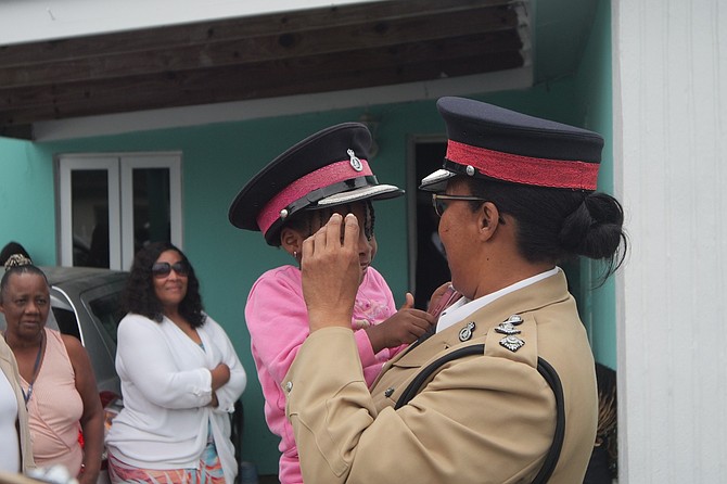 Chief Superintendent Chrislyn Skippings meeting with the family of murdered father Quintero Arnett to check on his daughter promising the family they will work diligently to get justice, yesterday. Photo: Chappell Whyms Jr