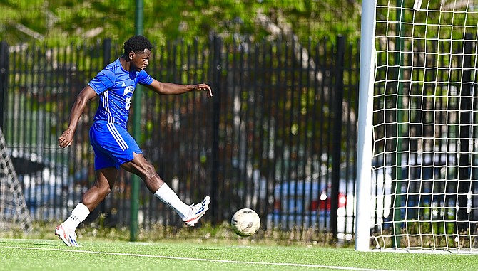University of The Bahamas Mingoes midfielder Ronaldo Green scores the penalty-kick.