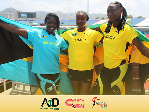 Annae Mackey poses with Jamicans Marla-Ky Lampart and Kimeka Smith at the 2025 CARIFTA Games at Hasely Crawford Stadium in Trinidad & Tobago on April 20, 2025
