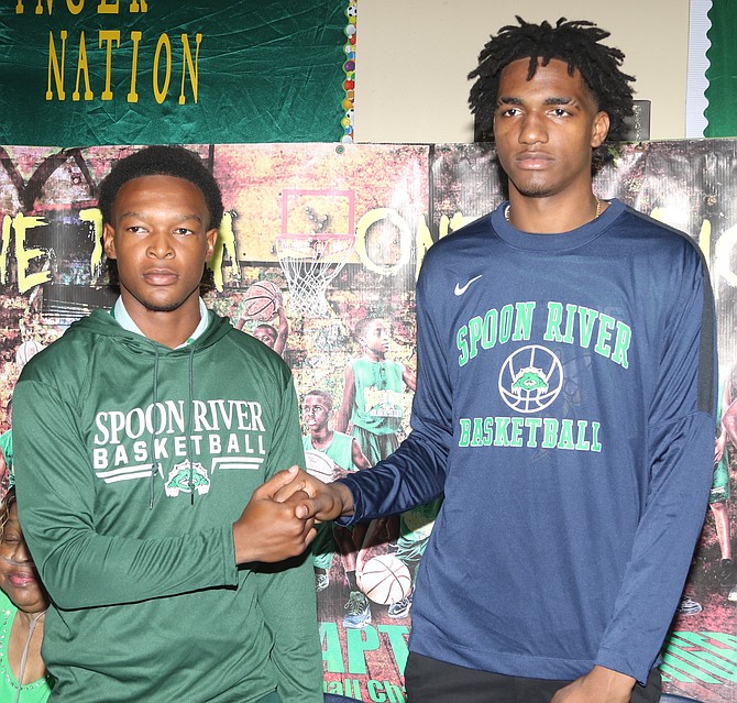 Sunland players Jermaine Woodside and Jason Williams shaking hands.