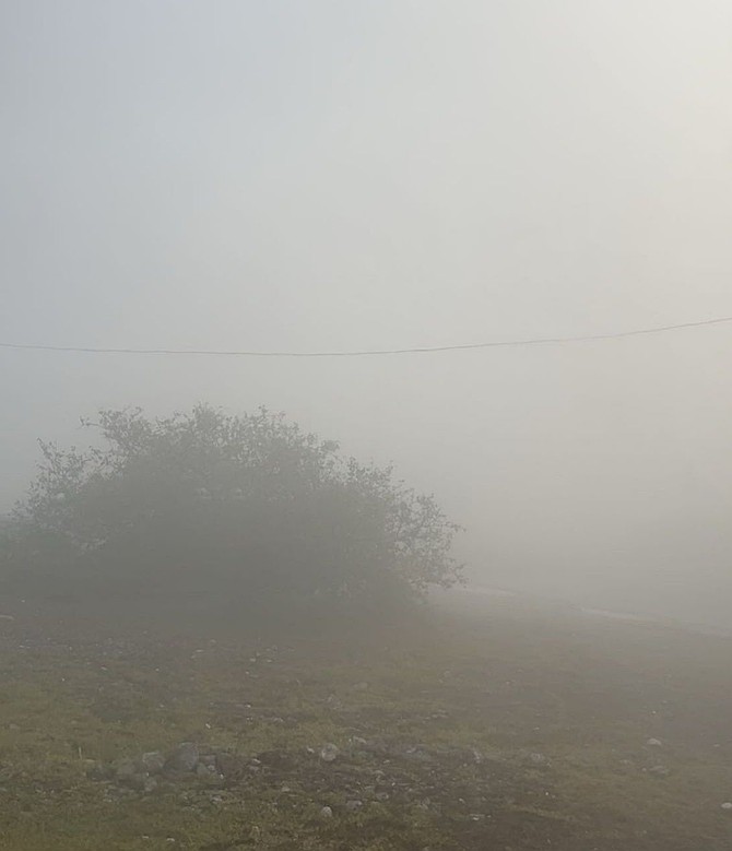 Smoke outside homes in Spring City, Abaco is reducing visibility and leaving residents feeling ill.