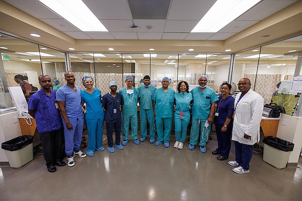 Members of the surgical team for a groundbreaking kidney transplant pose for a photo ahead of the procedure at Princess Margaret Hospital yesterday.  Photo: Dante Carrer/Tribune Staff