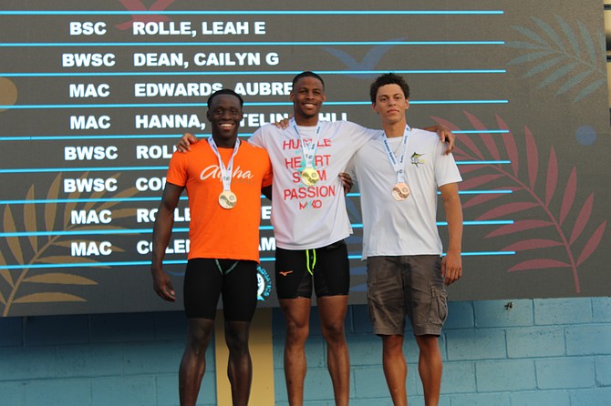 Swimmers receive their medals on Thursday - the first day of the 53rd annual Bahamas Aquatics swimming championships at the Betty Kelly Kenning Aquatic Centre. Photos: Jonathan Burrows