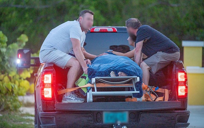 Boating accident victim being taken to Exuma clinic in the back of a truck.