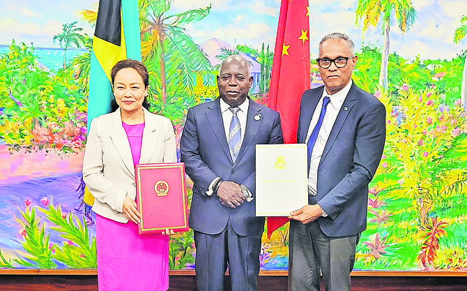 China Ambassador Yan Jiarong, Prime Minister Philip Davis and Health Minister Dr Michael Darville at the signing of the loan for the new hospital. 

Photo: Nikia Charlton