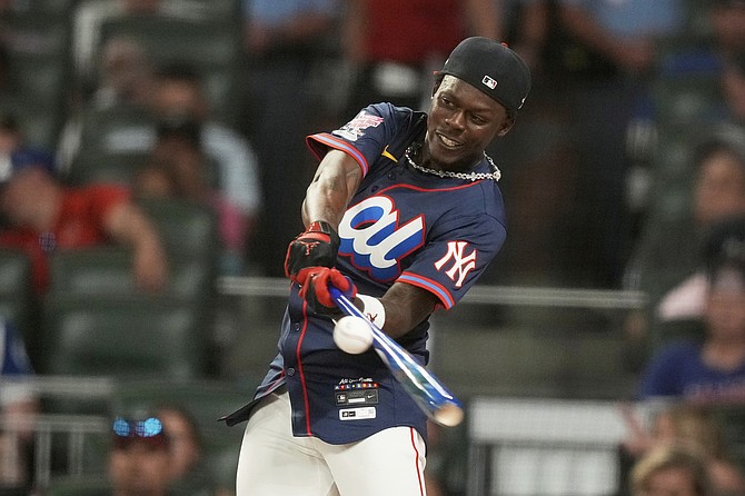New York Yankees’ Jasrado “Jazz” Chisholm Jr competes during the MLB baseball All-Star Home Run Derby last night in Atlanta. 
                                                                                                      (AP Photo/Brynn Anderson)