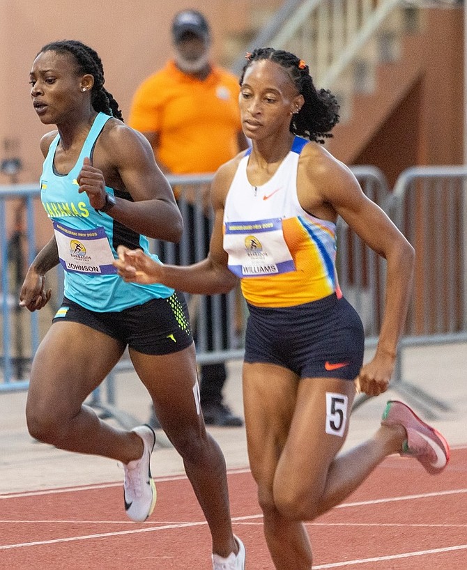 Barbados' Sada Williams holds off Bahamian Printassia Johnson in the wowen's 400m on Saturday in Barbados.