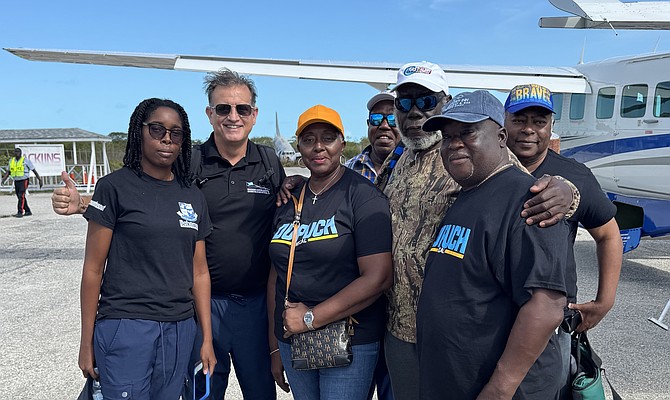 ROBERT Dupuch-Carron (second from left) visiting A*cklins over the weekend.