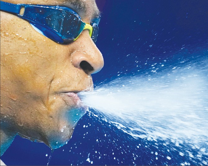 Lamar Taylor, of The Bahamas, prepares to compete in the men’s 50-meter freestyle heats at the World Aquatics Championships in Singapore.