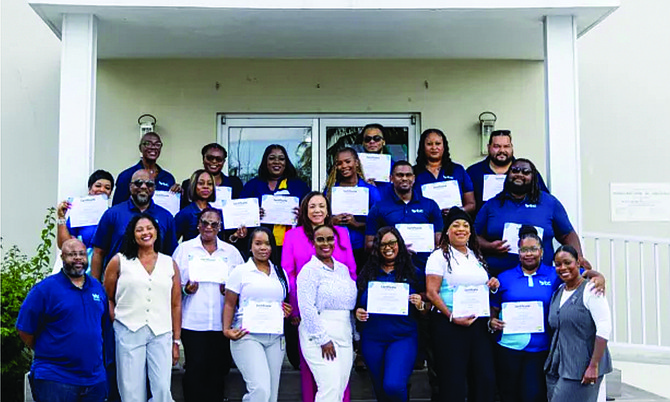 BTC’s second quarter top performers, and members of the company’s senior executive team, pose with their certificates following a recognition ceremony at the carrier’s Perpall Tract headquarters on August 13.
