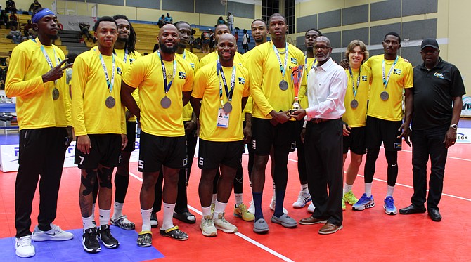 BAHAMAS men’s team runners-up receiving their awwards from BVF president Kurkwood Greene and Minister of Youth, Sports and Culture Mario Bowleg.