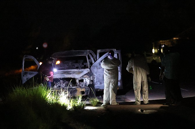 Crime scene investigators at the scene of a shooting on Munnings Road off Gladstone Road, where alleged gang leader Duran Neely succumbed to his injuries on August 26, 2025.