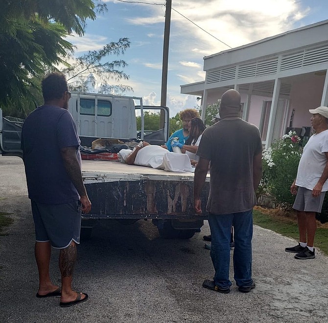 Brenda Wells was carried to an air ambulance on the back of a flatbed truck in pouring rain on September 8, 2025.