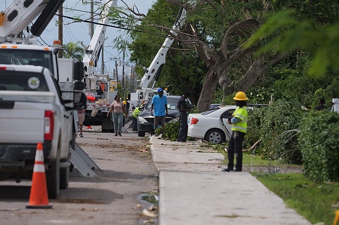 BPL crews work to assess damage and restore power in the Elizabeth Estates area on September 13, 2025.