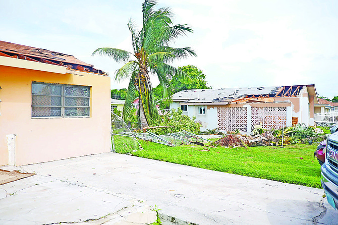 Home with a portion of roof damaged after what officials are calling a ‘microburst’ affected areas in the east of New Providence along Fox Hill Road. Photo: Chappell Whyms Jr