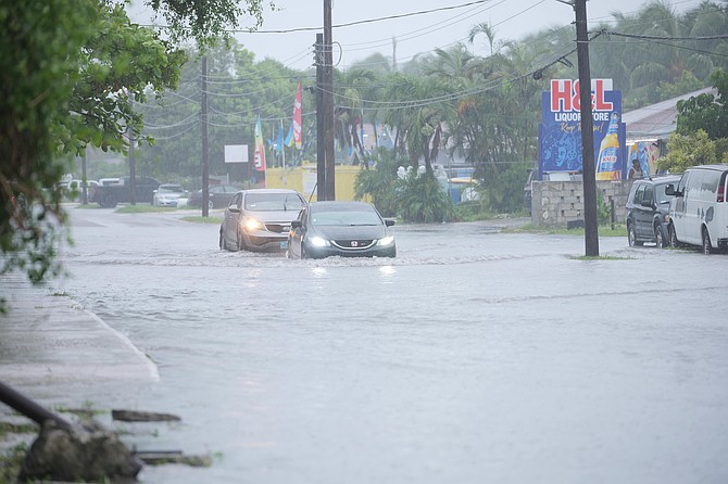 Vehicles push through flooded streets in New Providence as Tropical Storm Imelda passed through The Bahamas on September 28, 2025. Photo: Chappell Whyms Jr