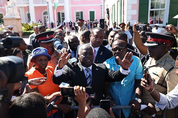Prime Minister Philip ‘Brave’ Davis stands between union leaders Belinda Wilson (left) and Kimsley Ferguson (right) after public servants marched on Bay Street demanding delayed or omitted pay increases among other issues on October 8, 2025. Photo: Dante Carrer/Tribune Staff