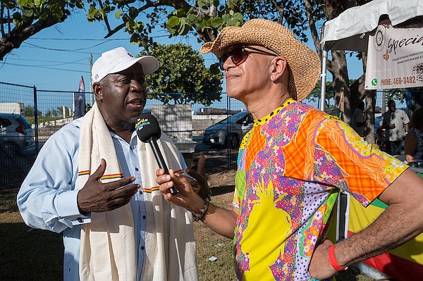 Prime Minister Philip Davis chats with Charlie “Charlie Bahama” Smith during the International Culture Wine & Food Festival (ICWFF) at Clifford Park. Photo: Dante Carrer/Tribune Staff